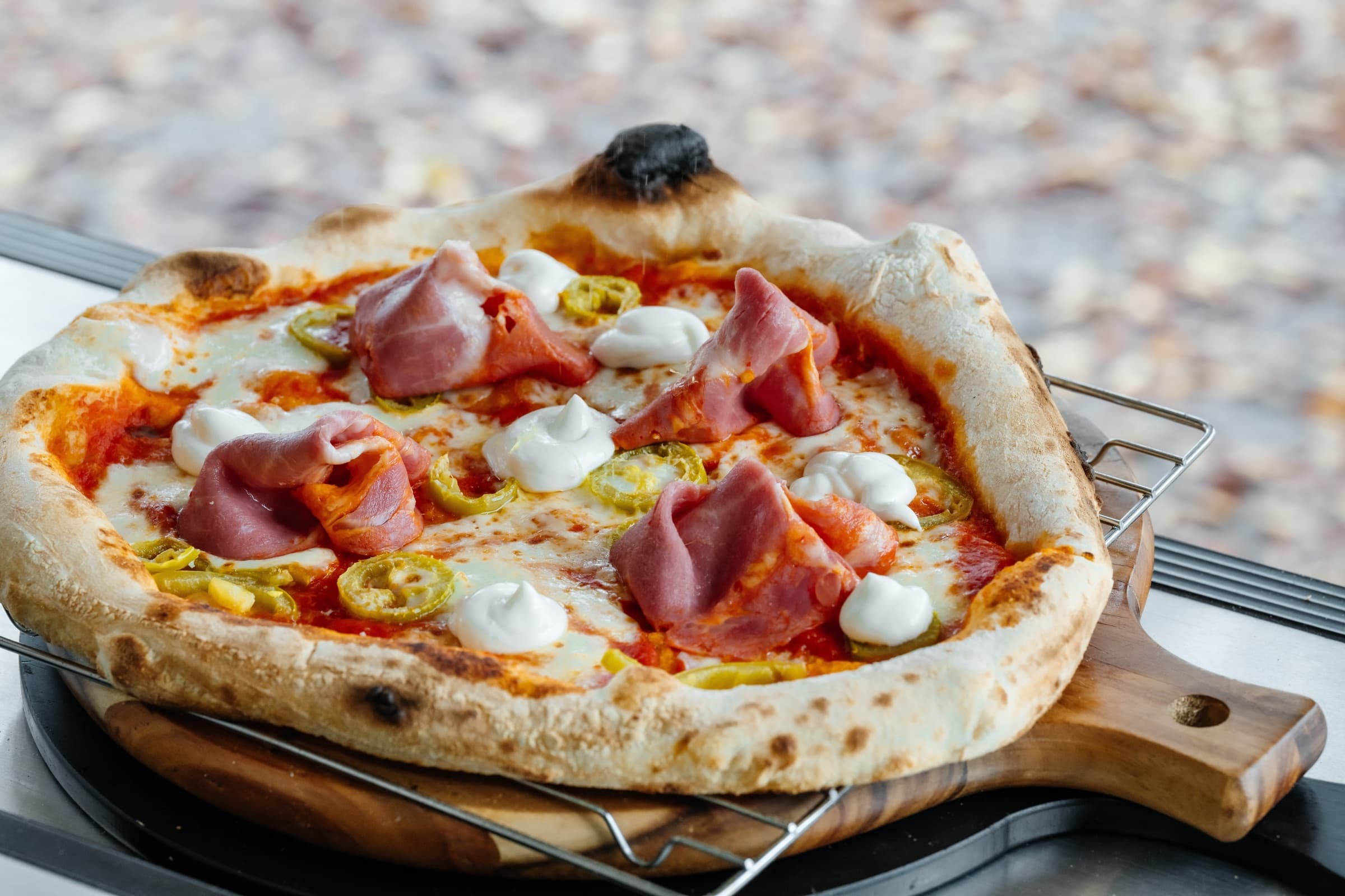 Close-up of a freshly baked Forno Via wood-fired pizza