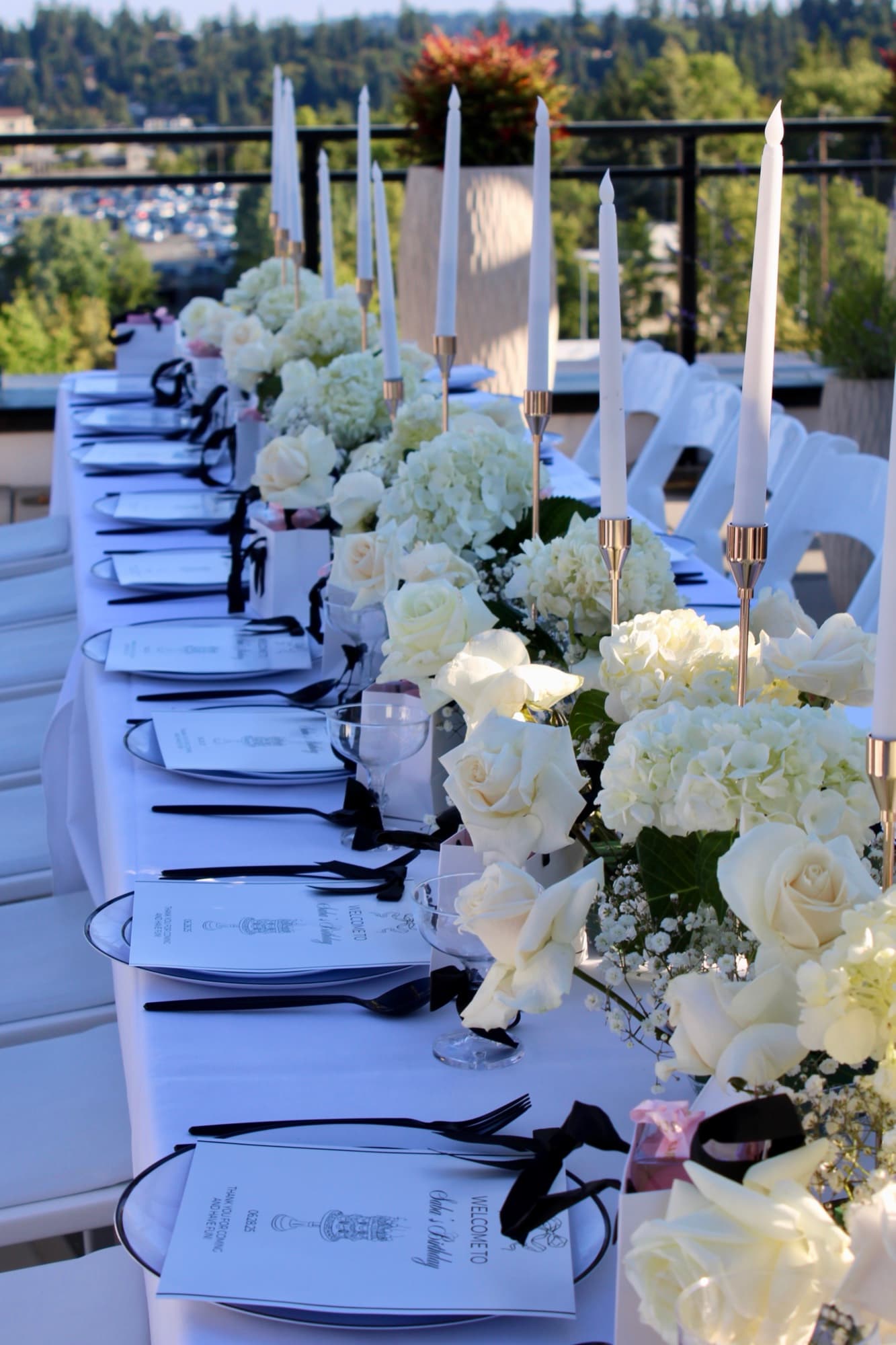 A close wedding table detail with florals and candles.
